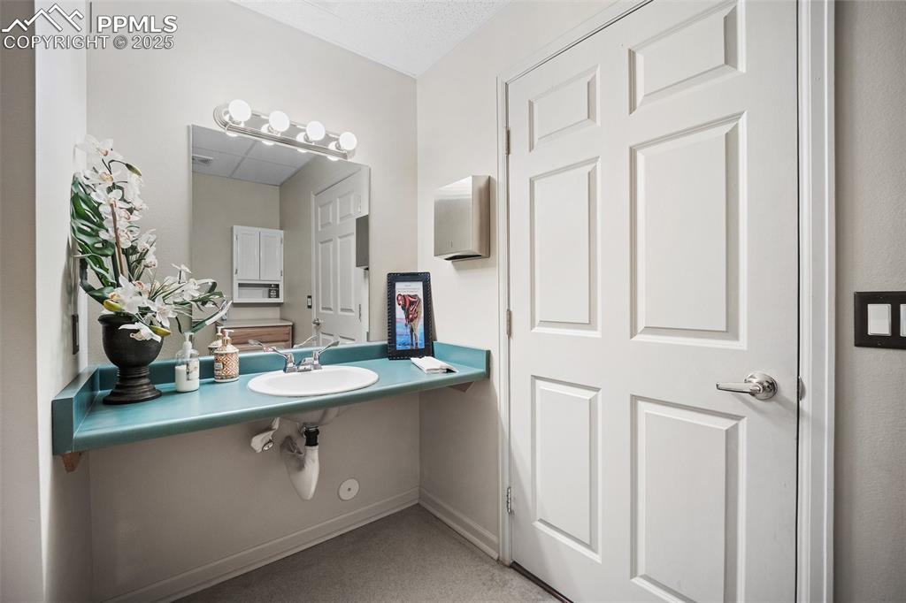 Image 40 of 50: Bathroom featuring a sink-5785 Building 