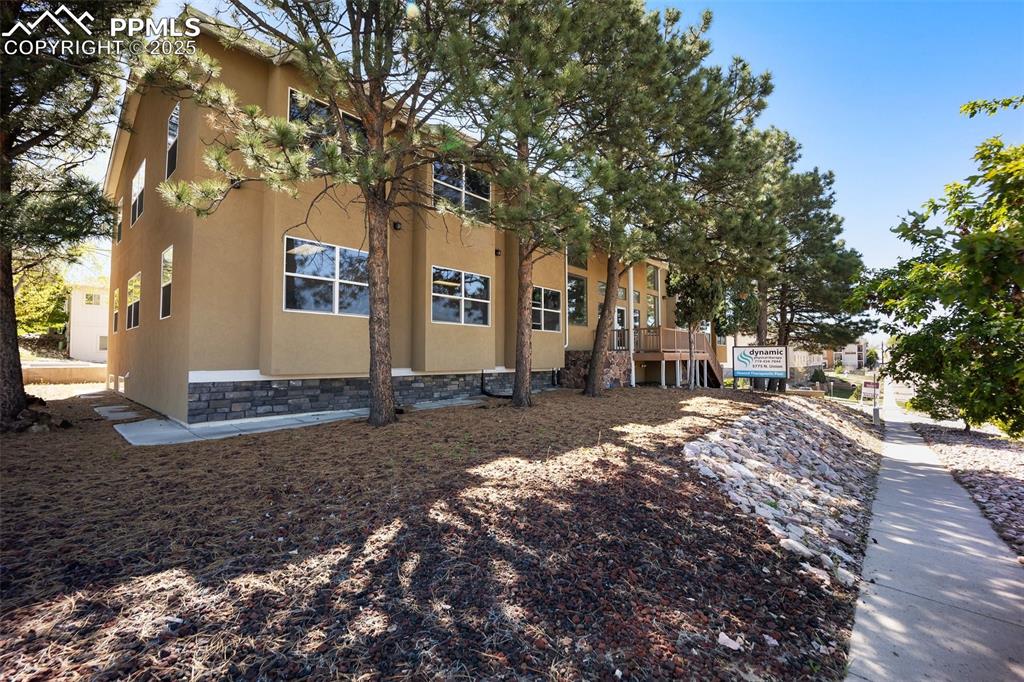 Image 50 of 50: View of side of home featuring stucco siding-5775 Building 