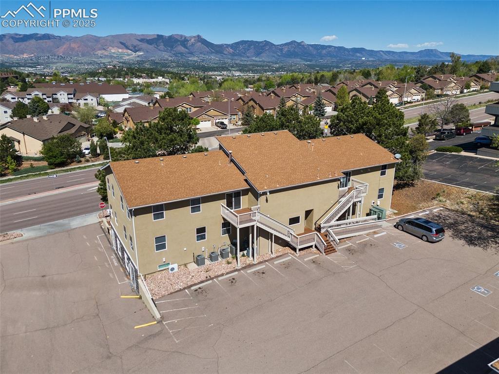 Image 7 of 50: Aerial view of residential area with a mountain backdrop