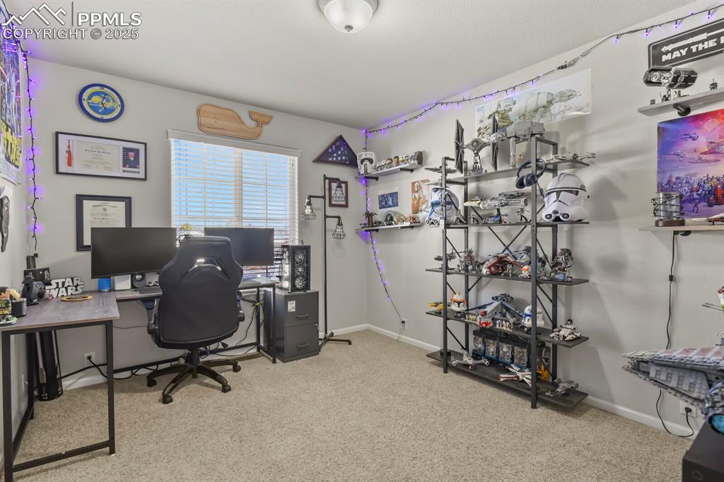 Image 19 of 27: Office space featuring light carpet and baseboards