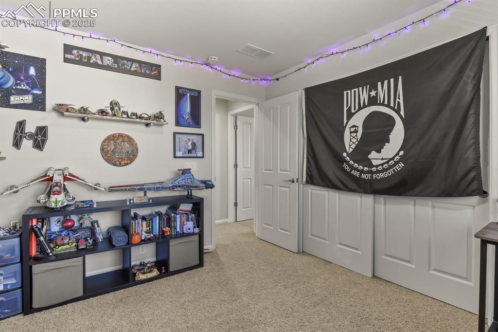 Image 20 of 27: Playroom featuring light colored carpet