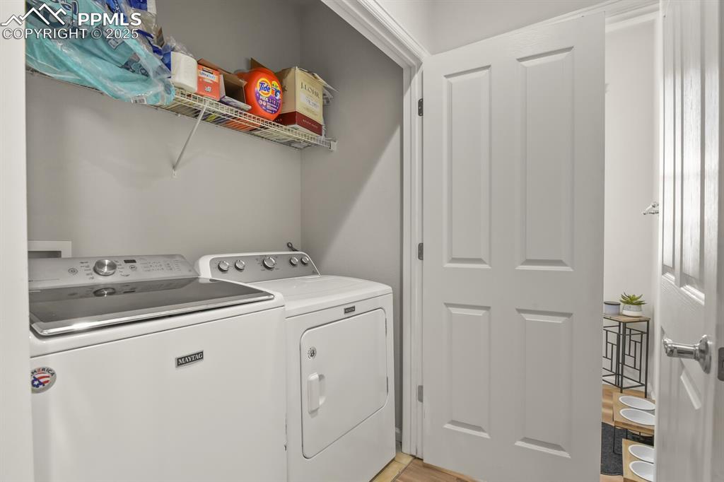 Image 25 of 27: Washroom with independent washer and dryer