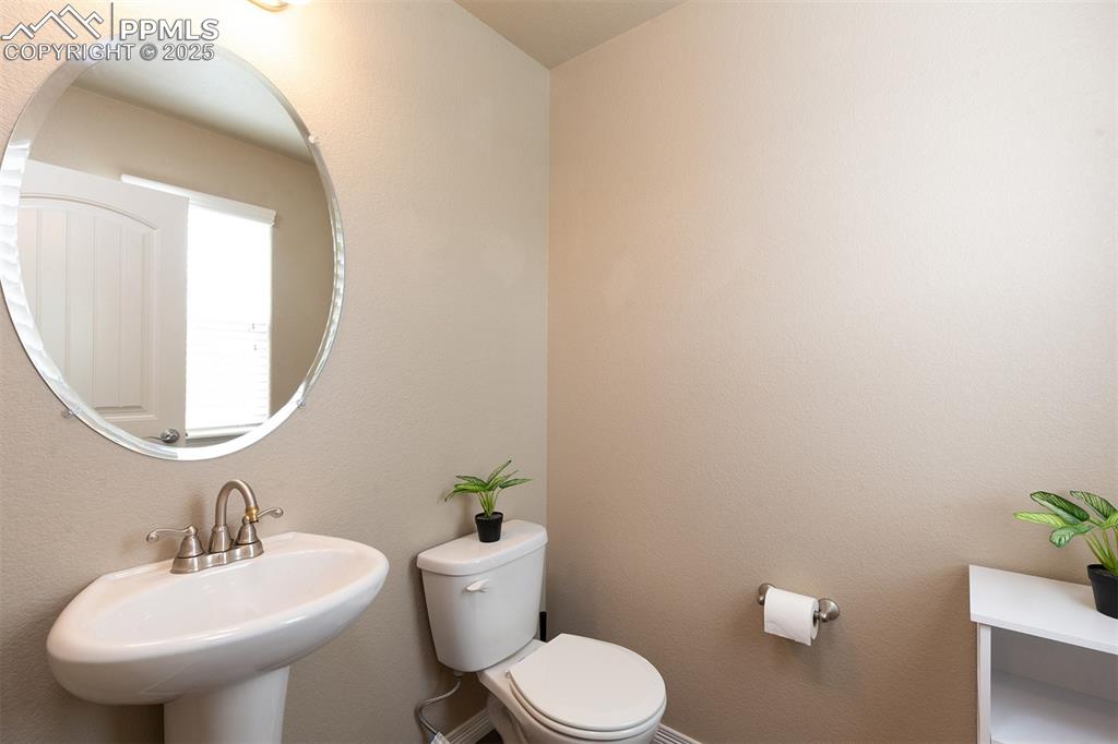 Image 21 of 40: Bathroom with a sink and toilet
