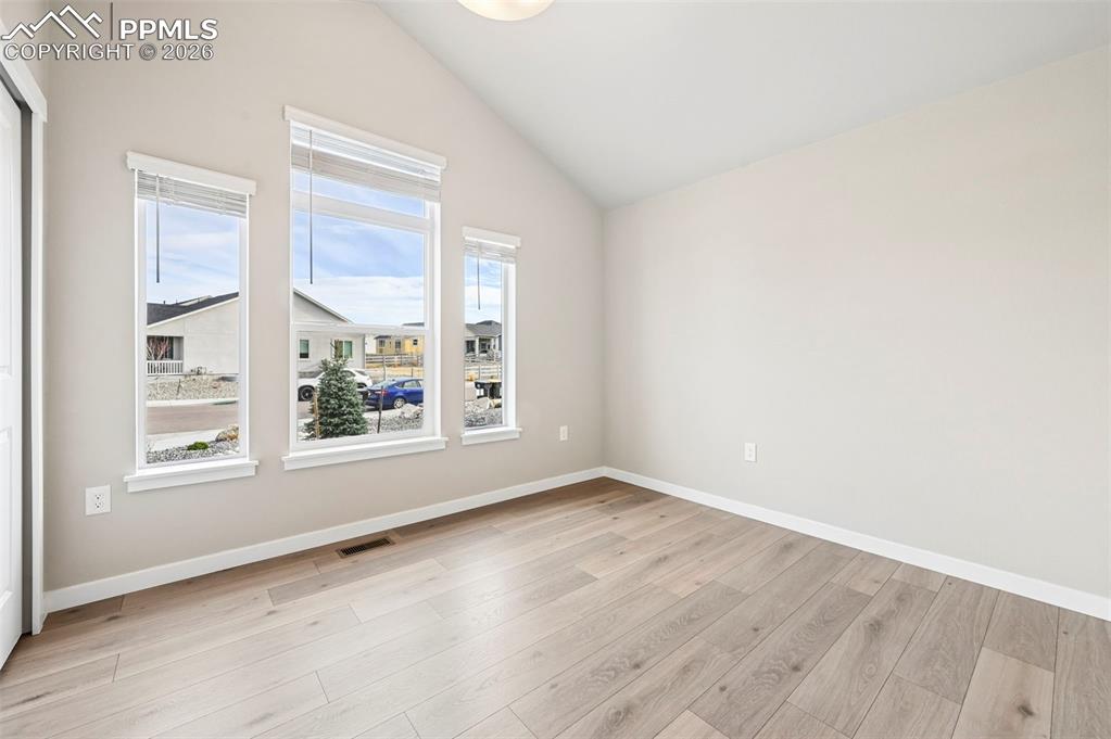 Image 28 of 50: Located in the Primary Bedroom with wood shelving