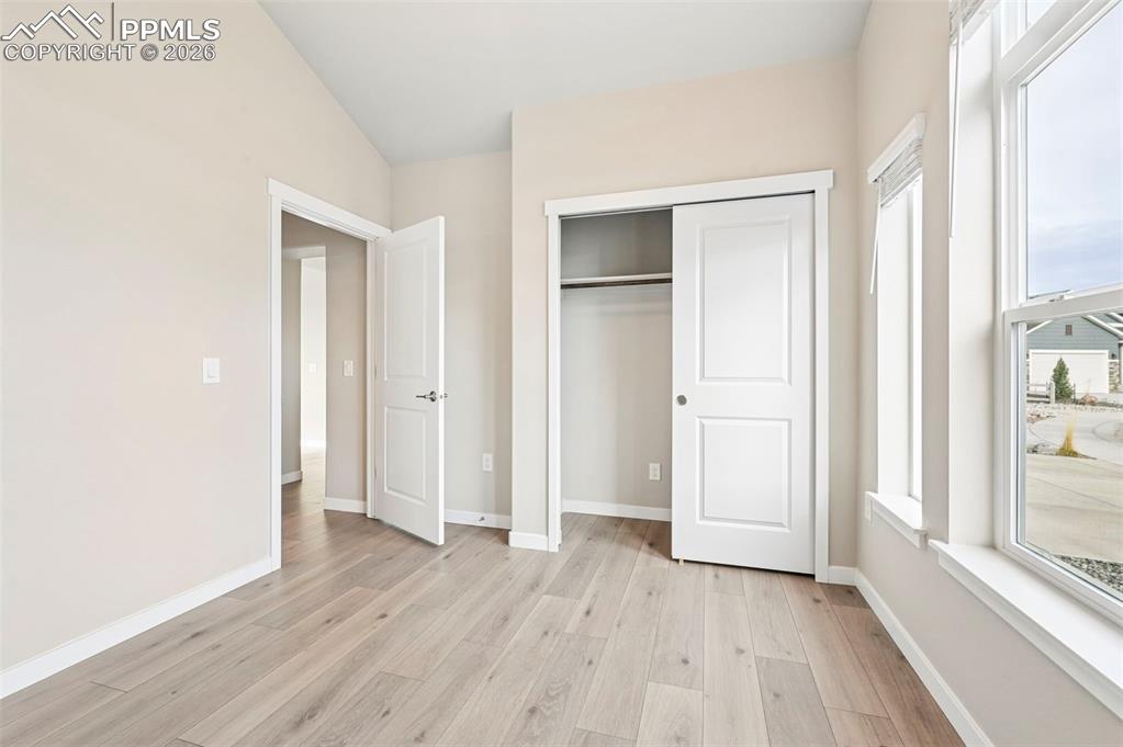 Image 30 of 50: Main level 2nd bedroom virtually staged