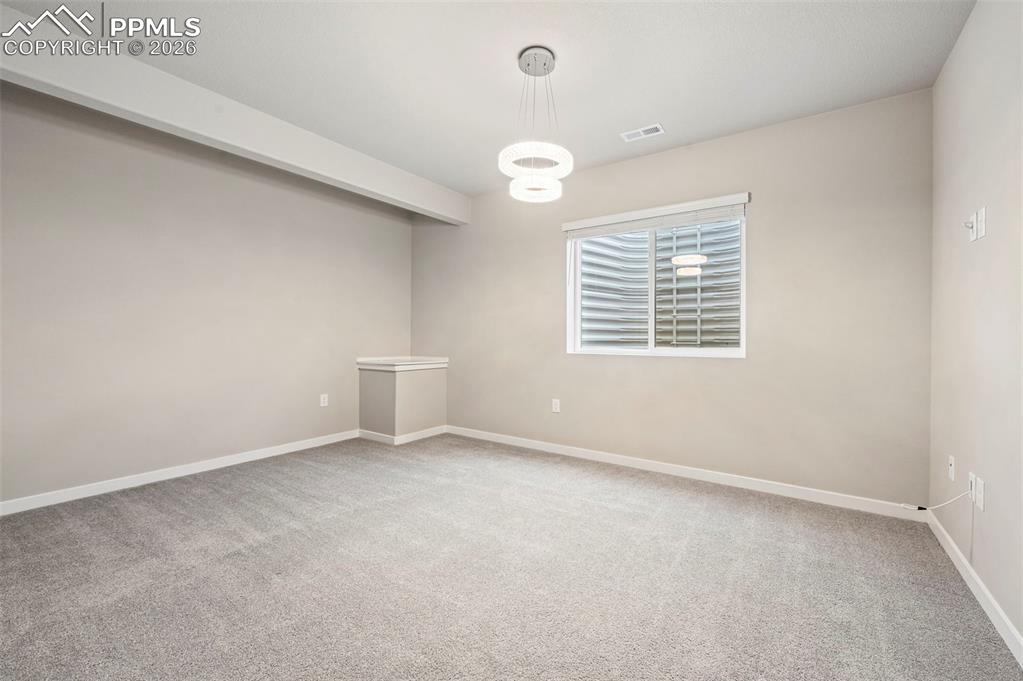 Image 42 of 50: Junior suite walk in closet featuring wood shelving