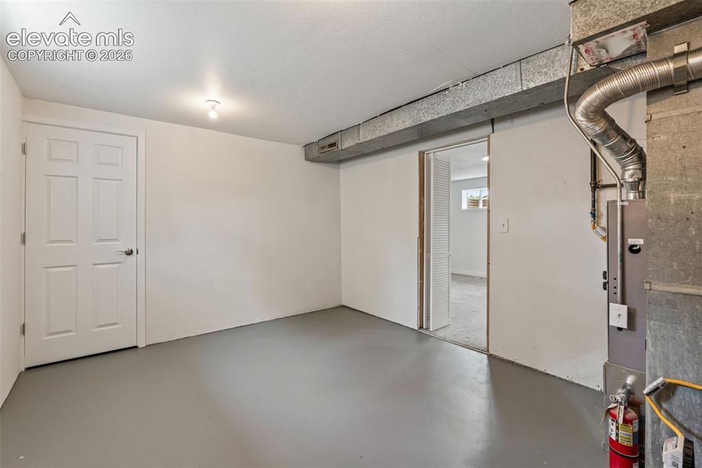 Image 32 of 35: Concrete flooring with a neutral finish