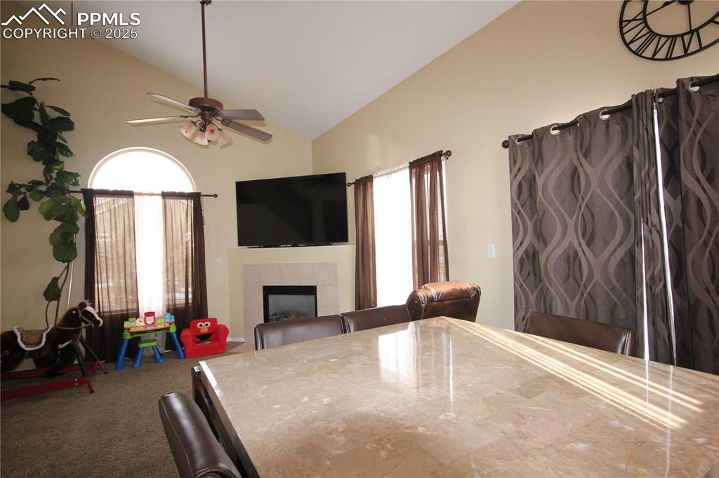 Image 10 of 32: Family room offers a cozy gas fireplace and vaulted ceilings