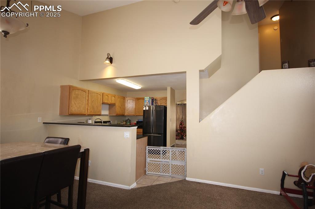 Image 11 of 32: Kitchen has a counter bar top