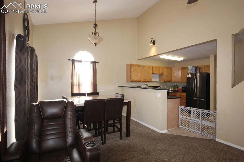 Image 9 of 32: The Dining room walks out to the 20x10 wood deck