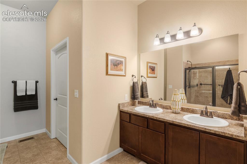 Image 22 of 33: Spacious ADA compliant shower and Toilet with Walk-in Closet