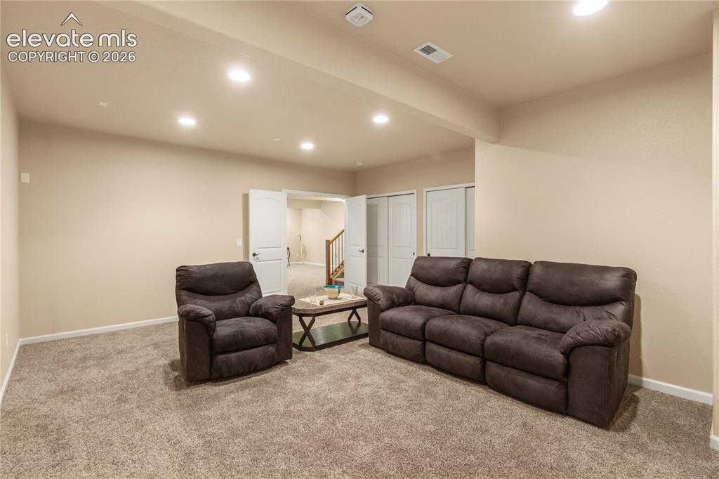 Image 28 of 33: Lower level with wiring for theatre surround sound,