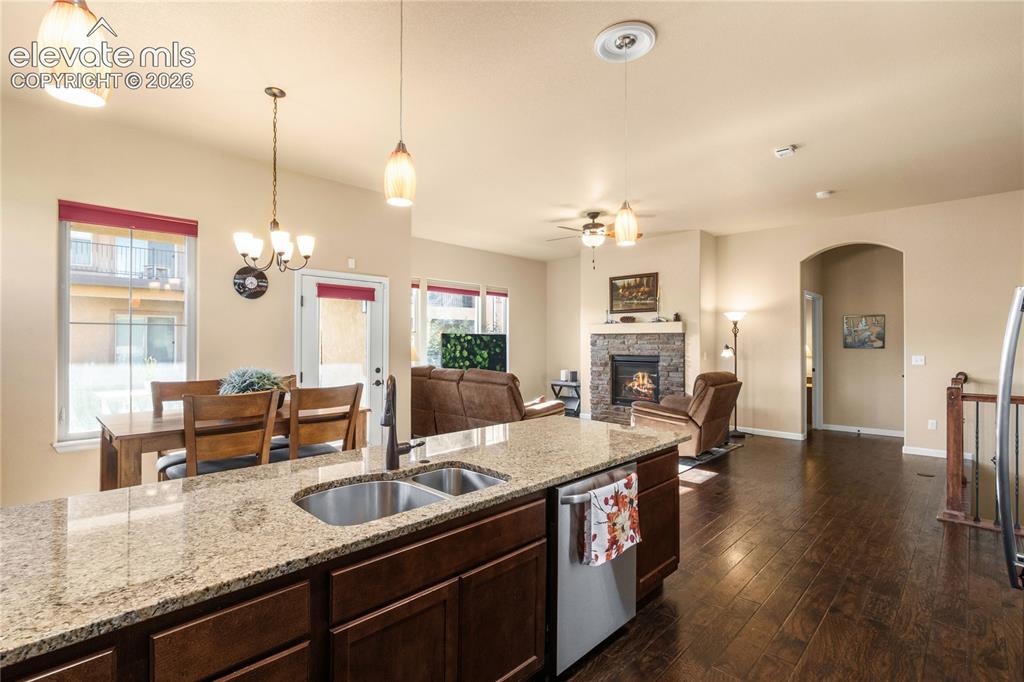 Image 9 of 33: Coat closet, Pantry closet and Foyer area leads into open living area