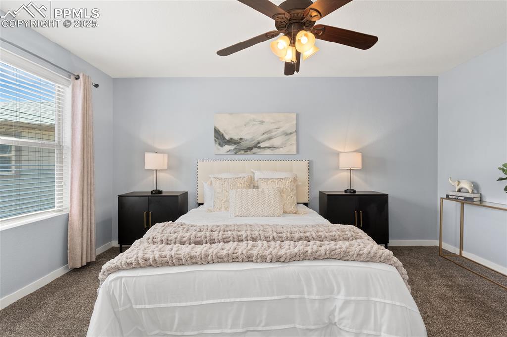 Image 14 of 33: Bedroom featuring carpet flooring and ceiling fan