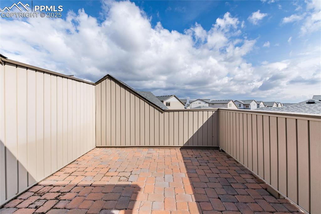 Image 28 of 33: View of patio with a residential view