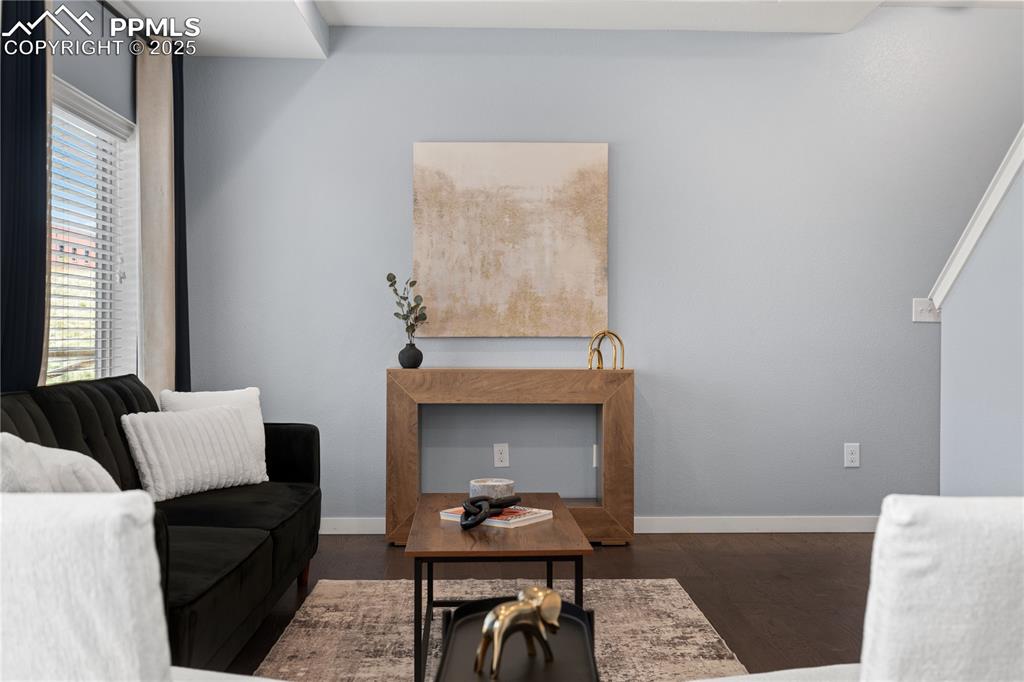 Image 4 of 33: Living room featuring plenty of natural light and wood finished floors