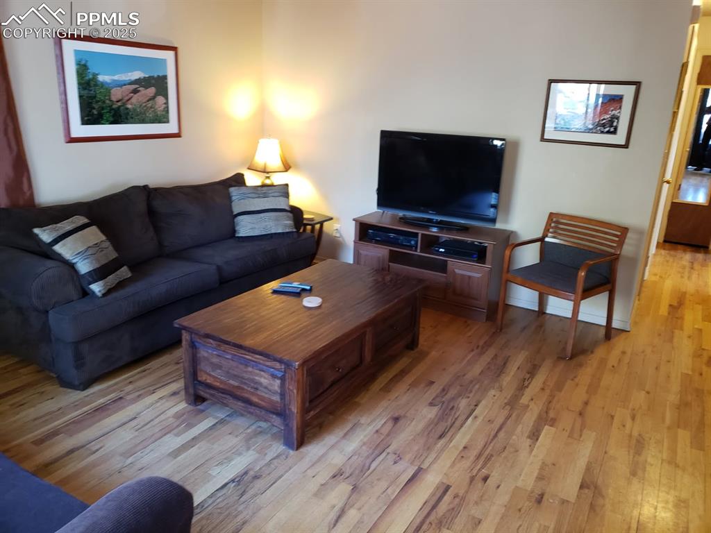 Image 5 of 7: Living room featuring light wood-type flooring