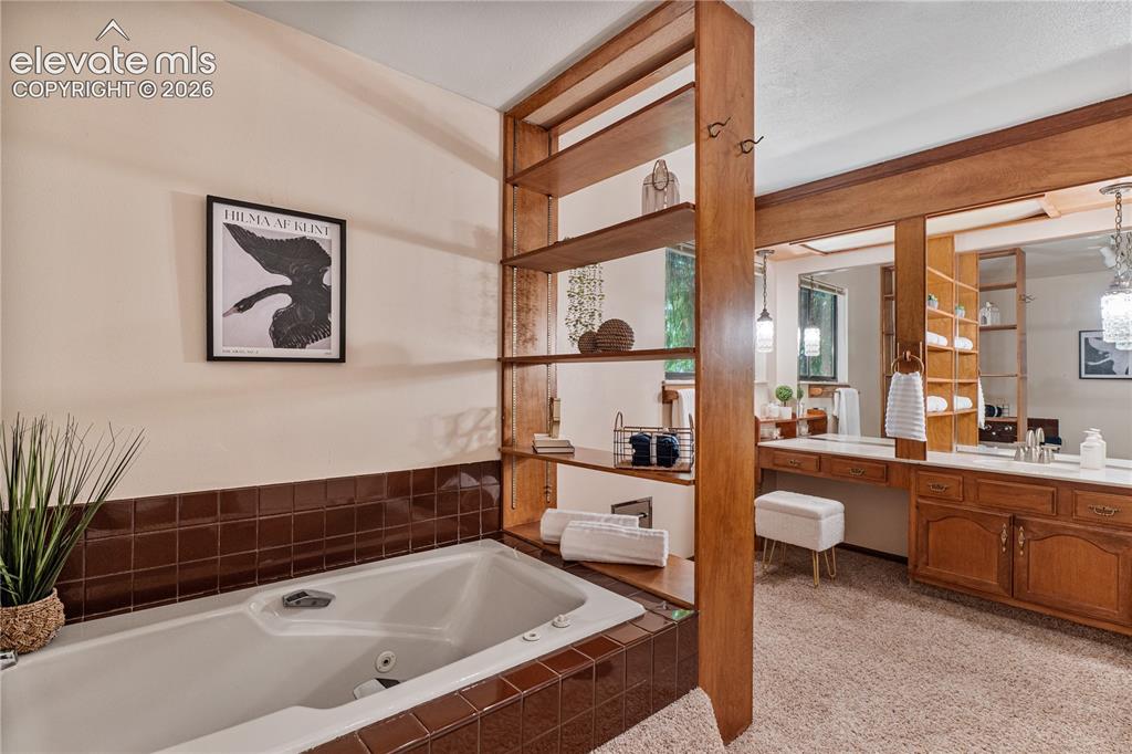 Image 17 of 49: Jetted Tub + Shower in the Primary!