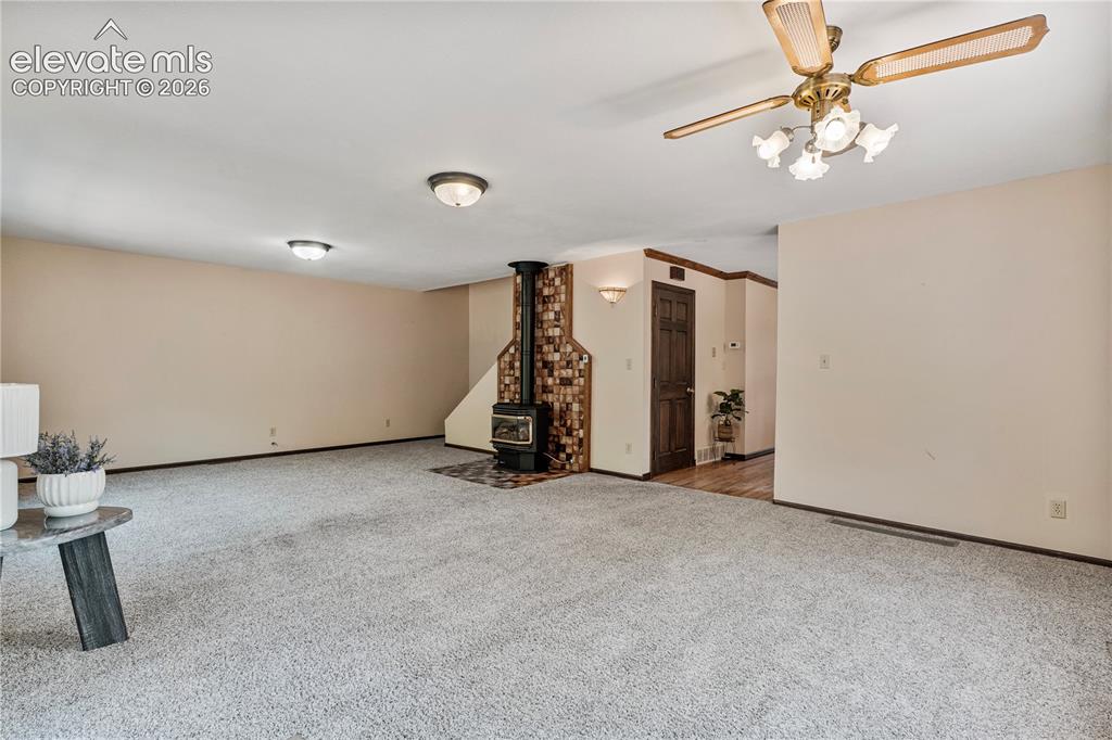 Image 20 of 49: Main Level Family/Dining Combo with Gas Fireplace!