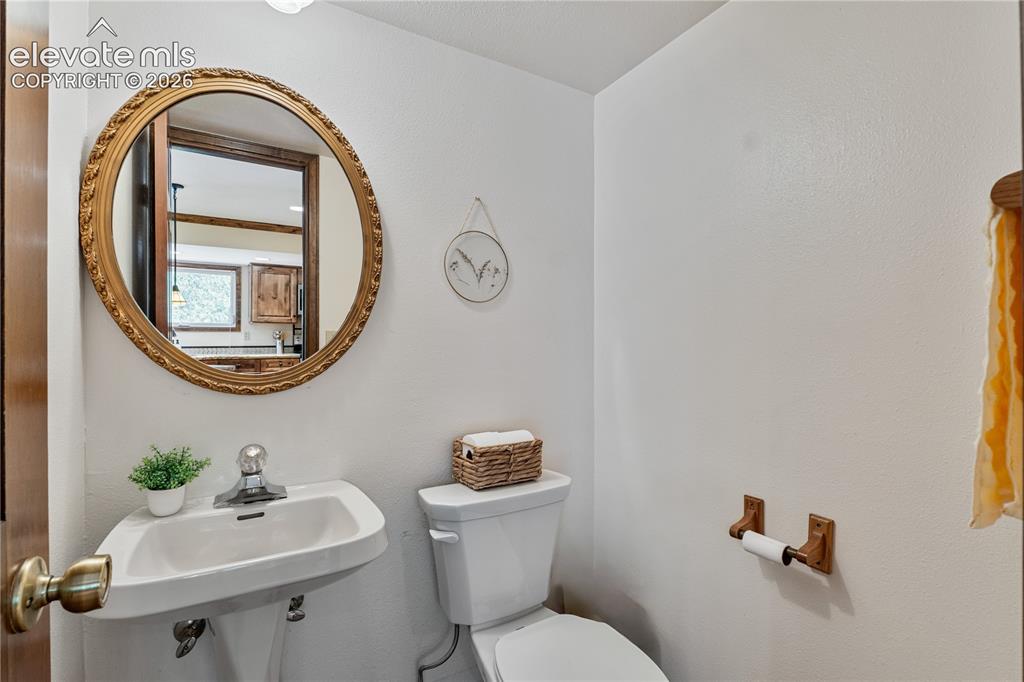 Image 21 of 49: Main Level Powder Room!