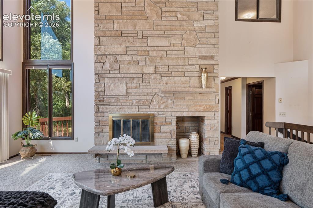 Image 3 of 49: Stunning 20 Foot custom masonry fireplace is the centerpiece of the spacio