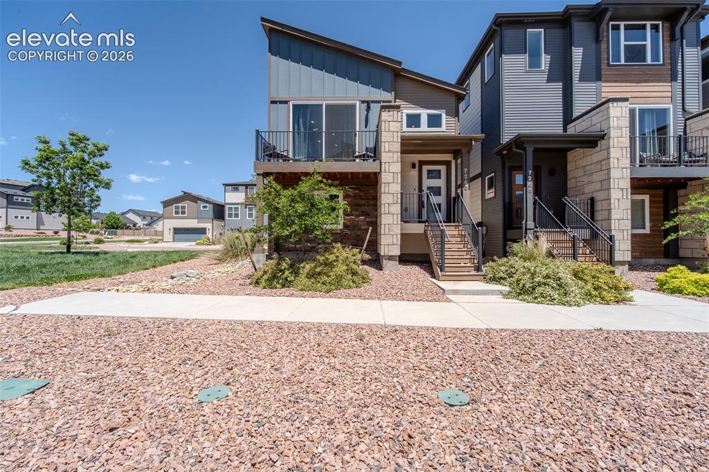 Image 1 of 46: Contemporary two bedroom, two bathroom, bi-level home, ideally situated on