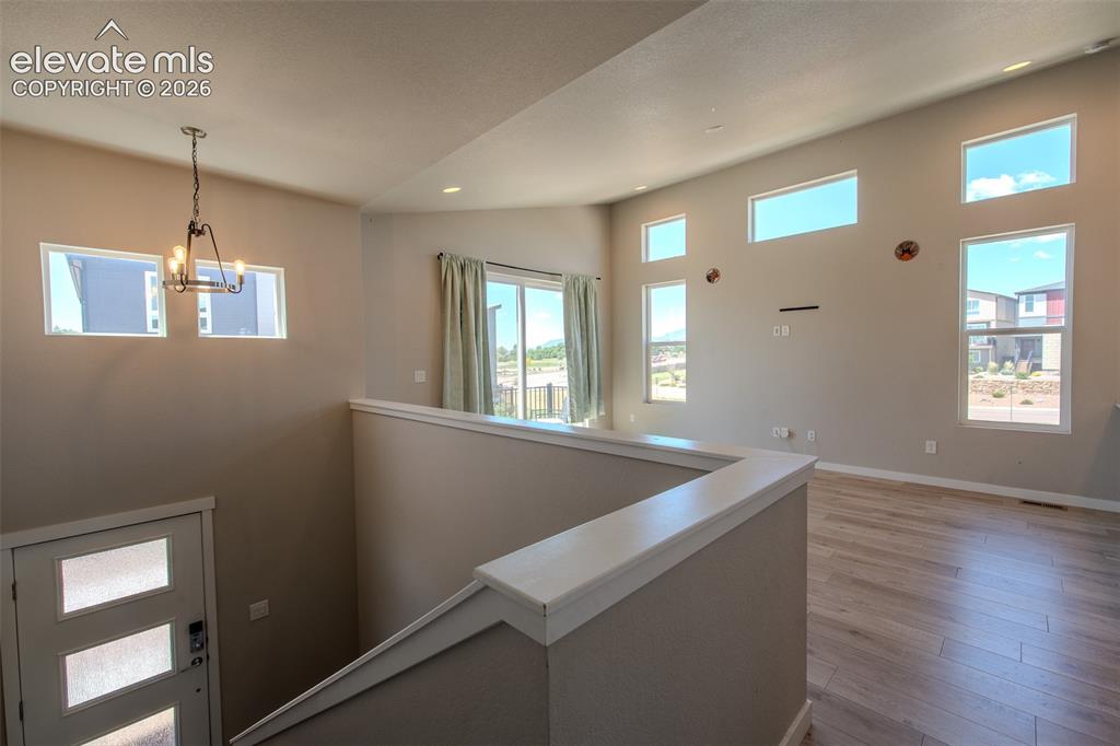 Image 11 of 46: Light and bright Living Room/Dining Room with beautiful LVP flooring and sl