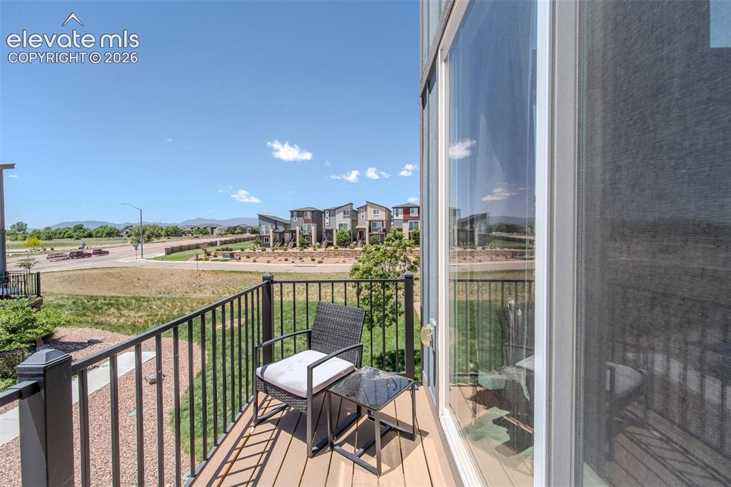 Image 15 of 46: Upper Level balcony with mountain views.