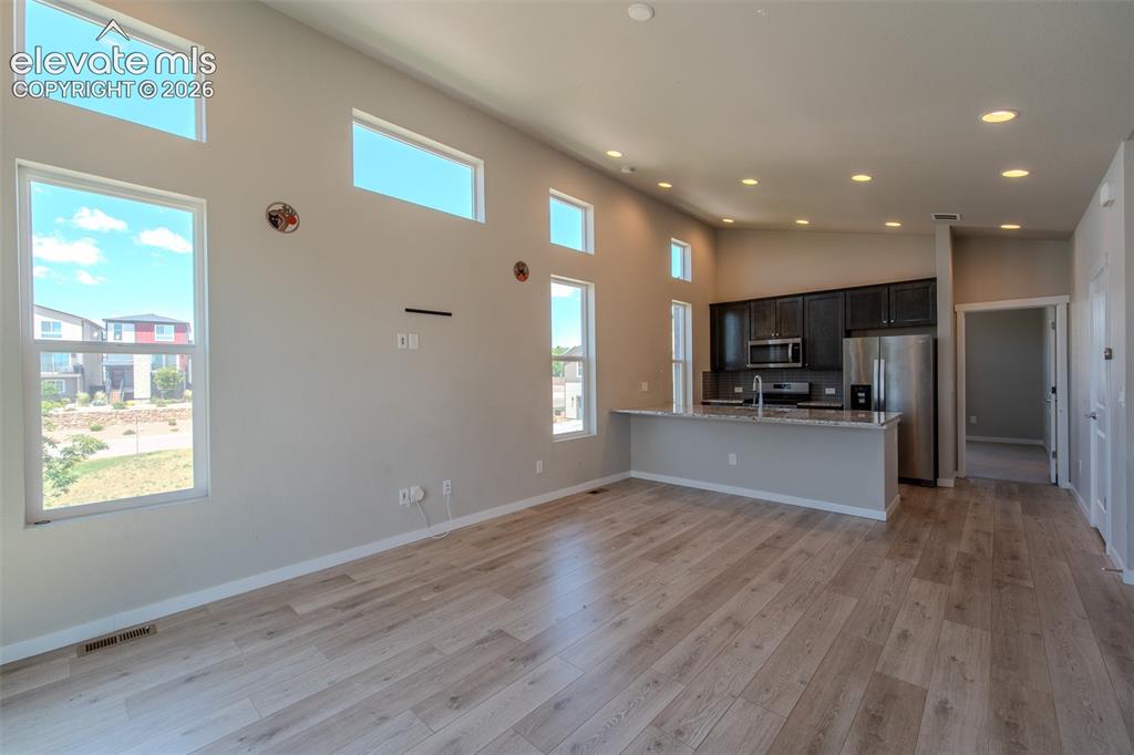 Image 17 of 46: Lots of windows that flood the room with natural light.