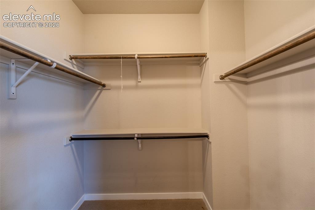 Image 30 of 46: Primary Bedroom walk-in closet.