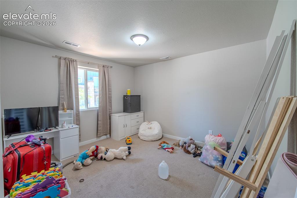Image 34 of 46: Lower Level Bedroom with neutral carpet.