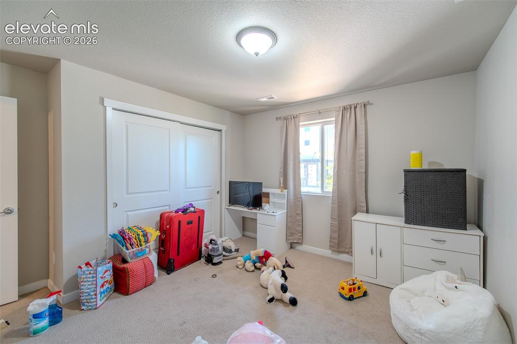 Image 35 of 46: Lower Level Bedroom with neutral carpet.