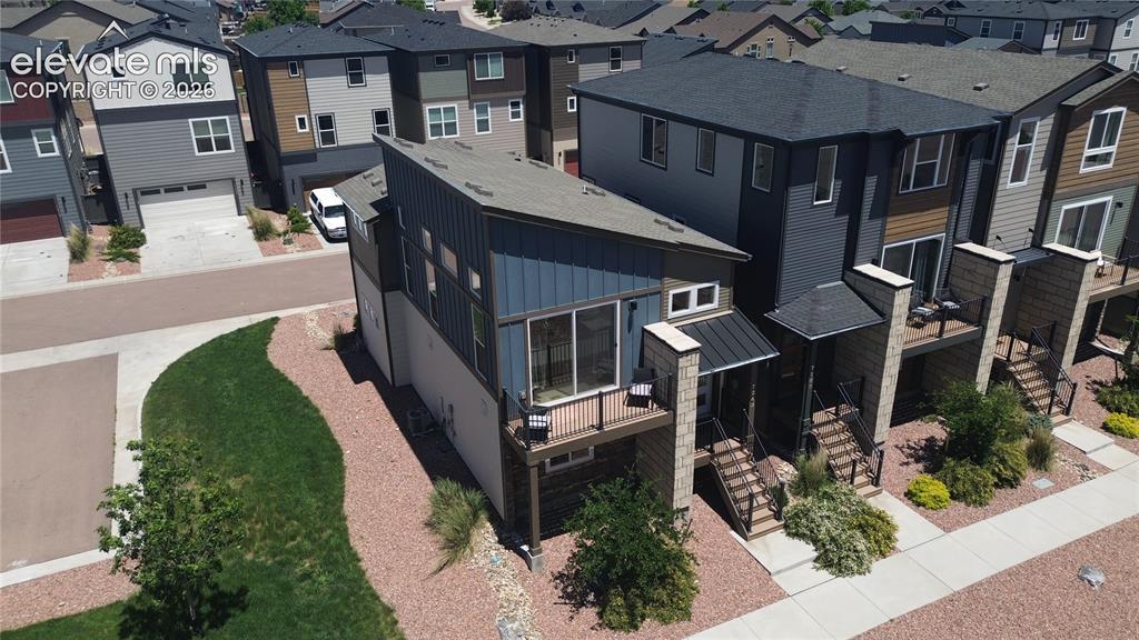 Image 4 of 46: Aerial view of xeriscaped side yard.