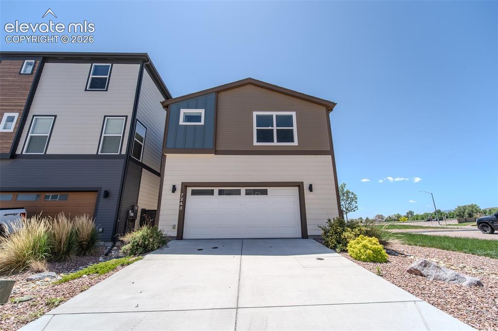 Image 42 of 46: Rear of home and view of corner lot.