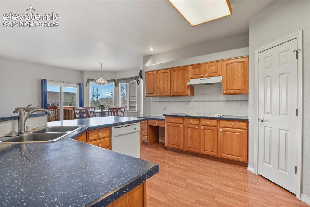 Image 10 of 45: Lots of cabinets and a walk-in pantry!