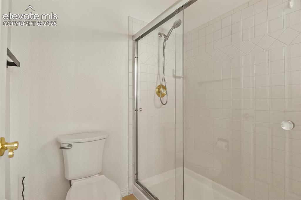Image 25 of 50: Primary Separate Shower and toilet area with a door!
