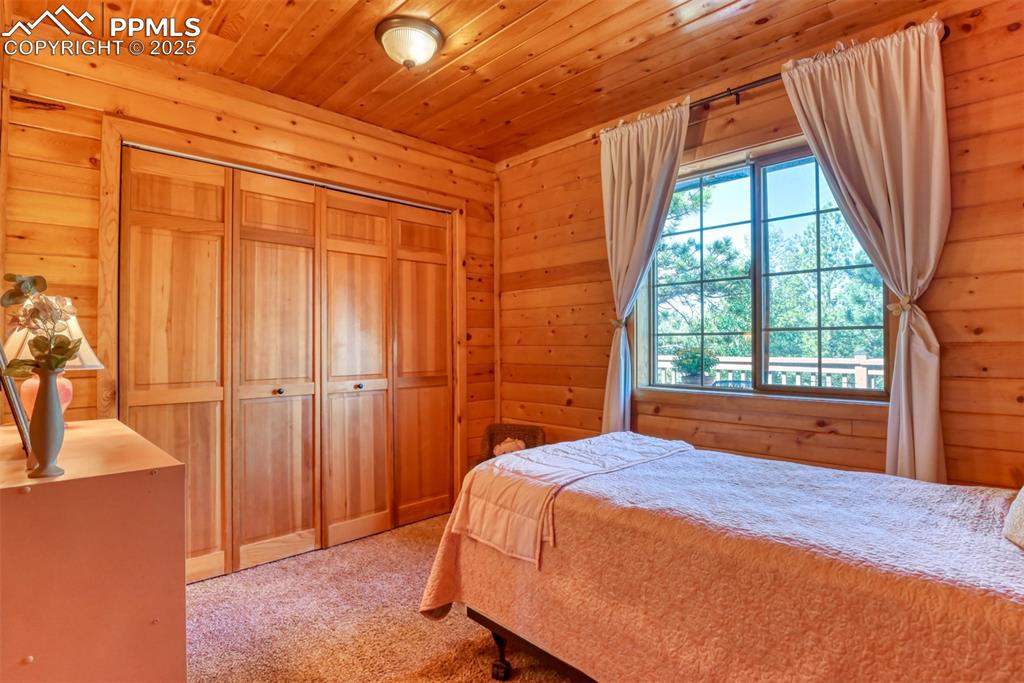 Image 15 of 38: Bedroom with wall-to-wall closet