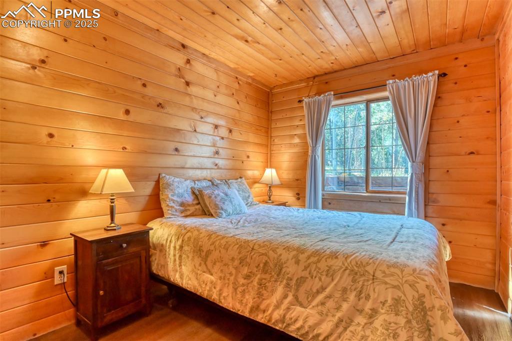 Image 27 of 38: Primary bedroom, newer LVP flooring.
