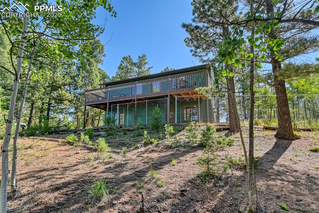 Image 4 of 38: Large deck, lower-level walk out, back yard