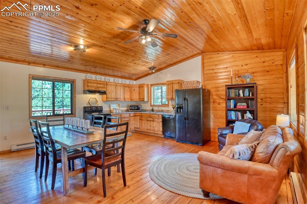 Image 8 of 38: Great room with vaulted ceilings