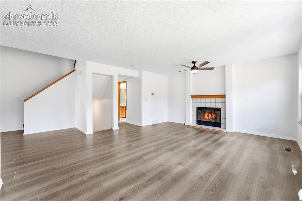 Image 10 of 47: Dining area with new LVP flooring, and additional living room or family roo