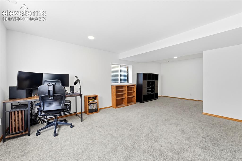 Image 34 of 47: Spacious room featuring light-colored carpeting, white walls, recessed ligh