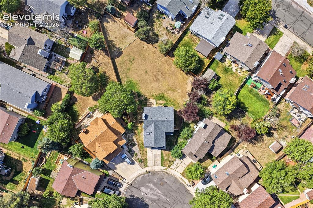 Image 44 of 47: Aerial perspective of a cul-de-sac with surrounding residential properties,