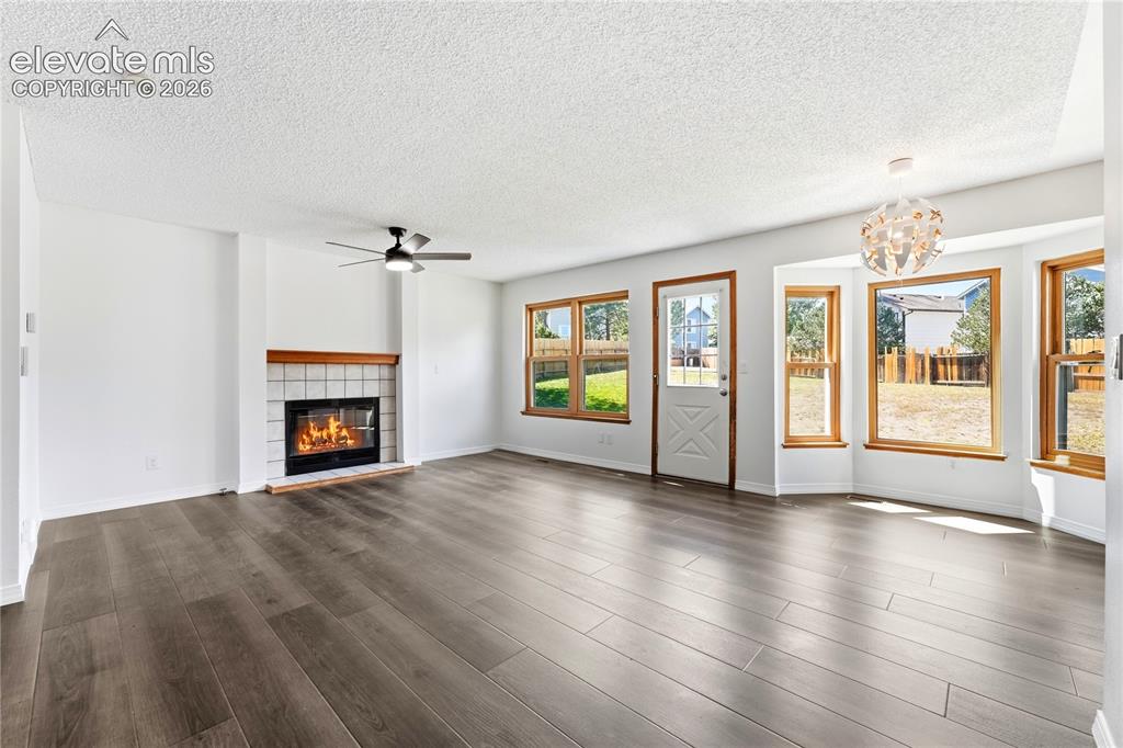 Image 9 of 47: Dining area with new LVP flooring, and additional living room or family roo