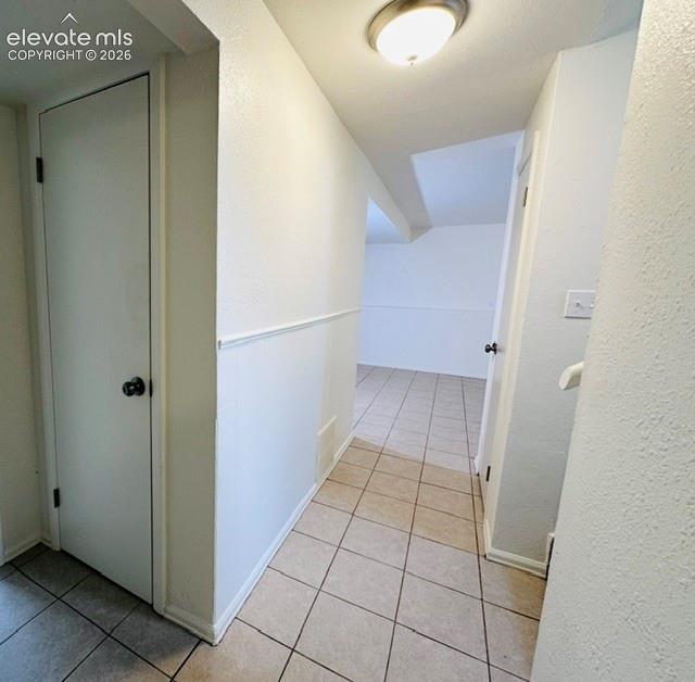 Image 11 of 20: Tile flooring throughout the lower level
