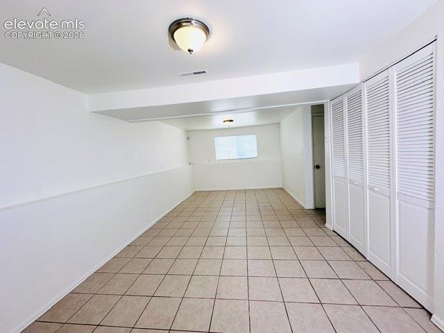 Image 13 of 20: Family room with laundry closet