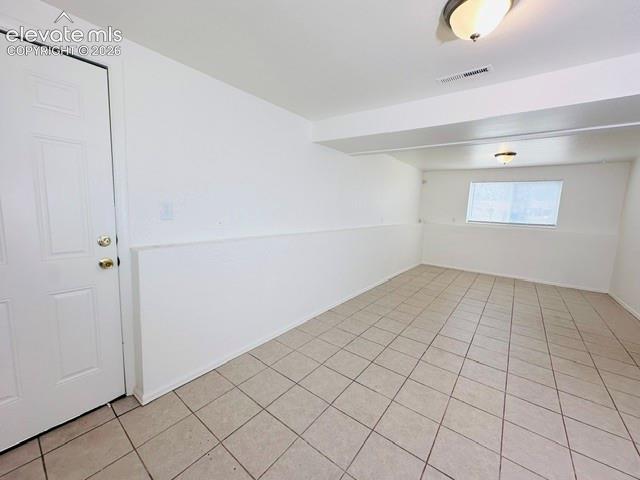 Image 14 of 20: Family room with garage access