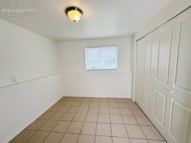 Image 17 of 20: Lower level rear facing bedroom