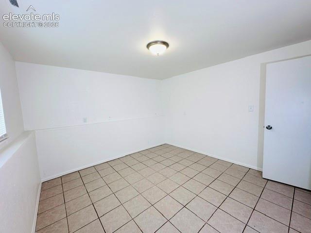 Image 18 of 20: Lower level front facing bedroom with new closet doors