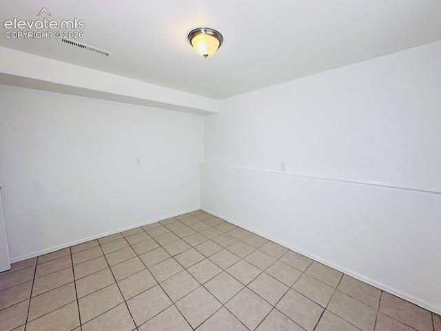 Image 19 of 20: Lower level front facing bedroom